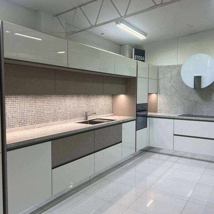 L-Shaped Gloss Finish Kitchen with Round Wall Hood