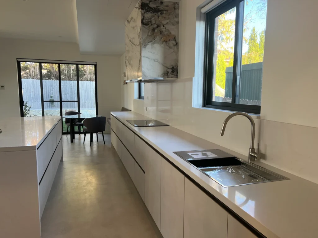 galley-kitchen-island-sink-dining-area