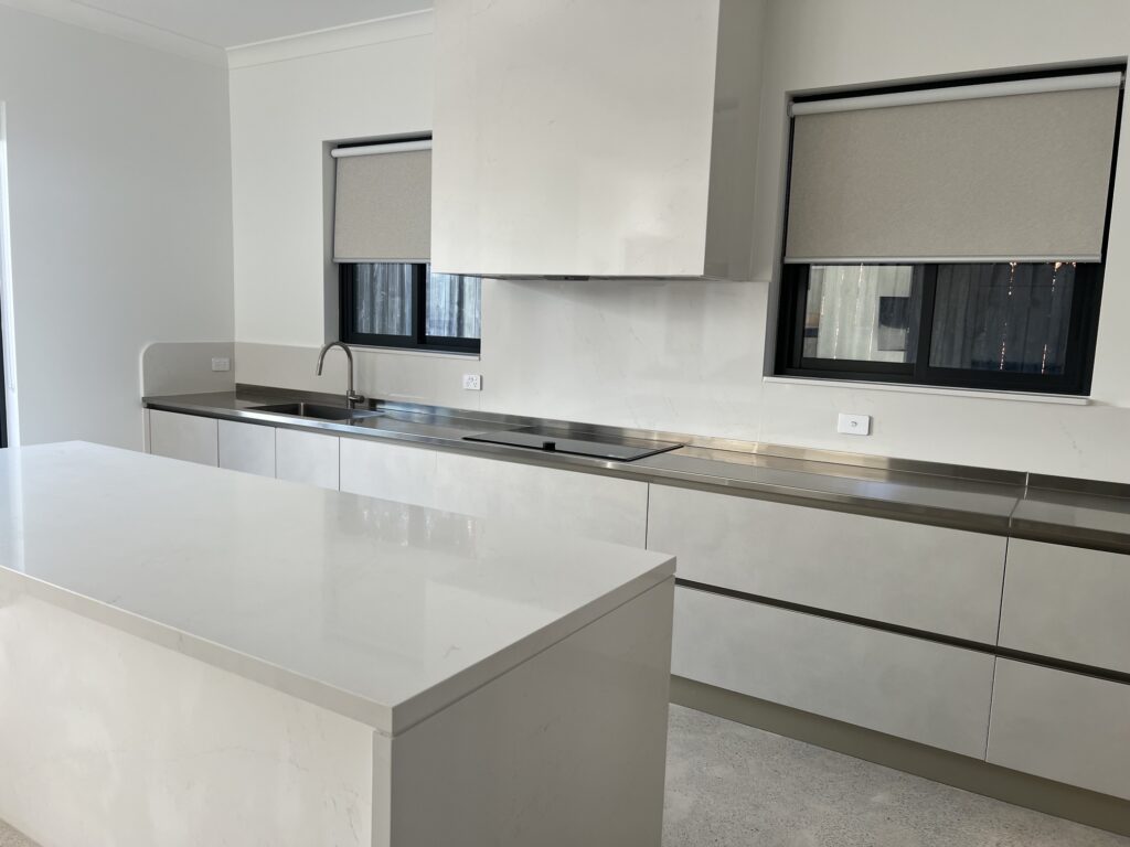 white-kitchen-island-stainless-steel-benchtop