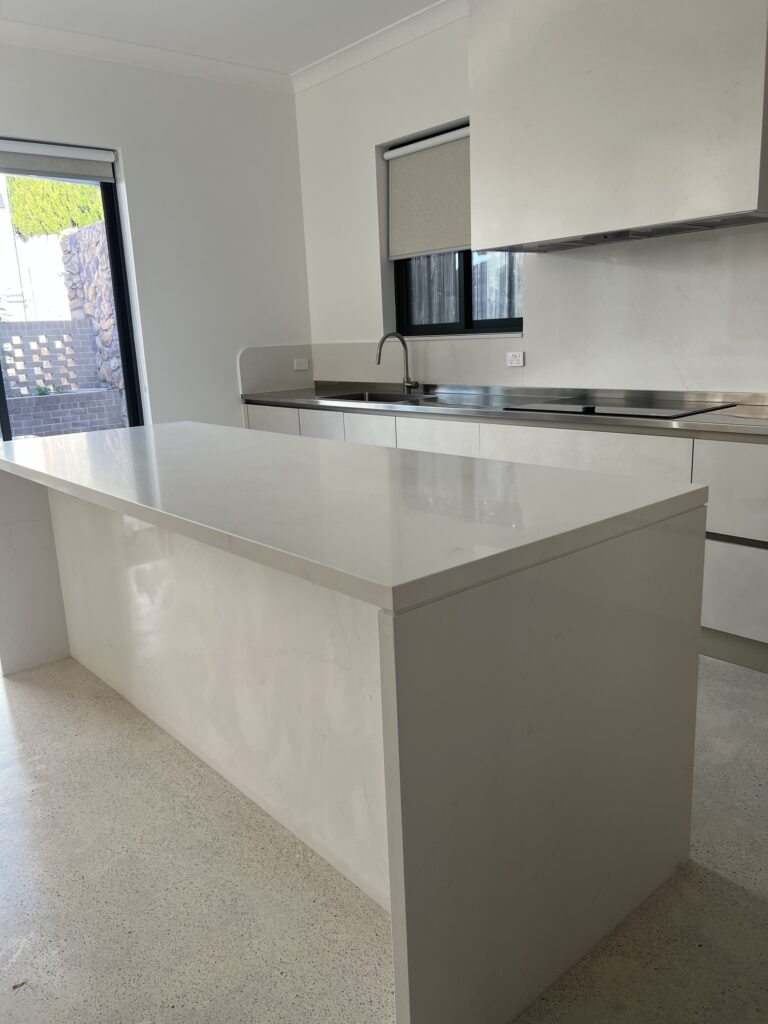 white-kitchen-island-stainless-steel-worktop